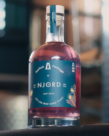 Bottle of Njord gin with a blue label on a blurred background